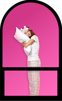 a tenant of a Link Apartments studio holding a pillow in her hands